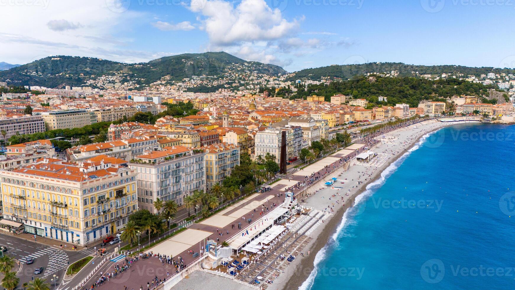 Aerial view of Nice, France, showcasing the vibrant Promenade des Anglais, colorful buildings, and the sparkling blue waters of the Mediterranean Sea photo