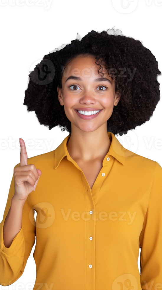 Smiling woman in yellow shirt pointing upwards on transparent background, confident and cheerful look png