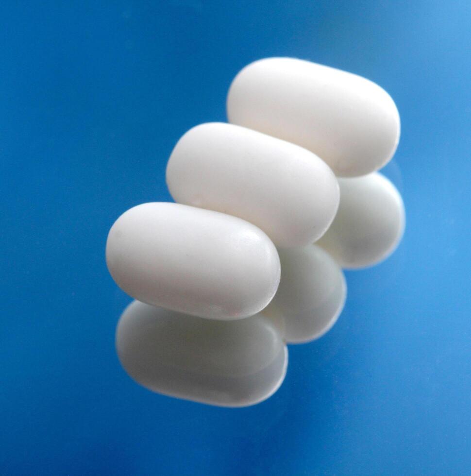 capsule like white sweet candy,mint taste photo