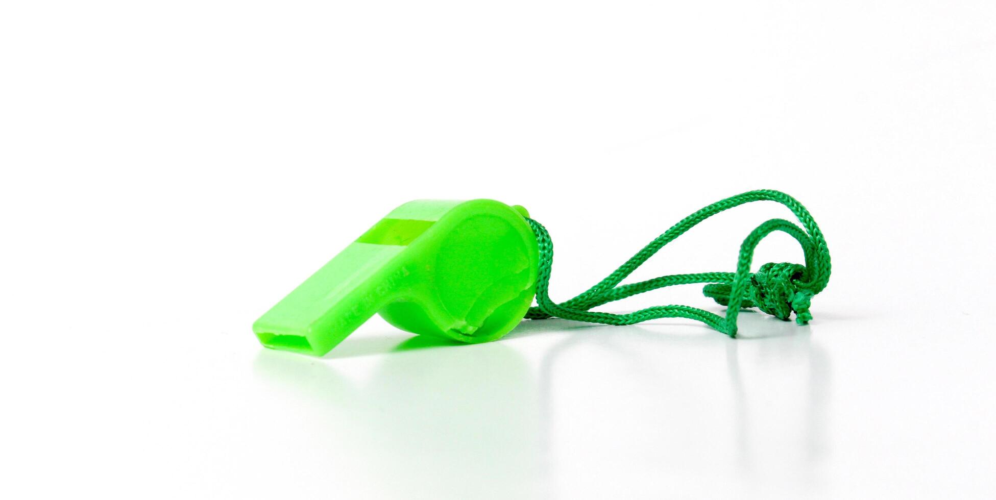 green referee whistle, sport theme photo