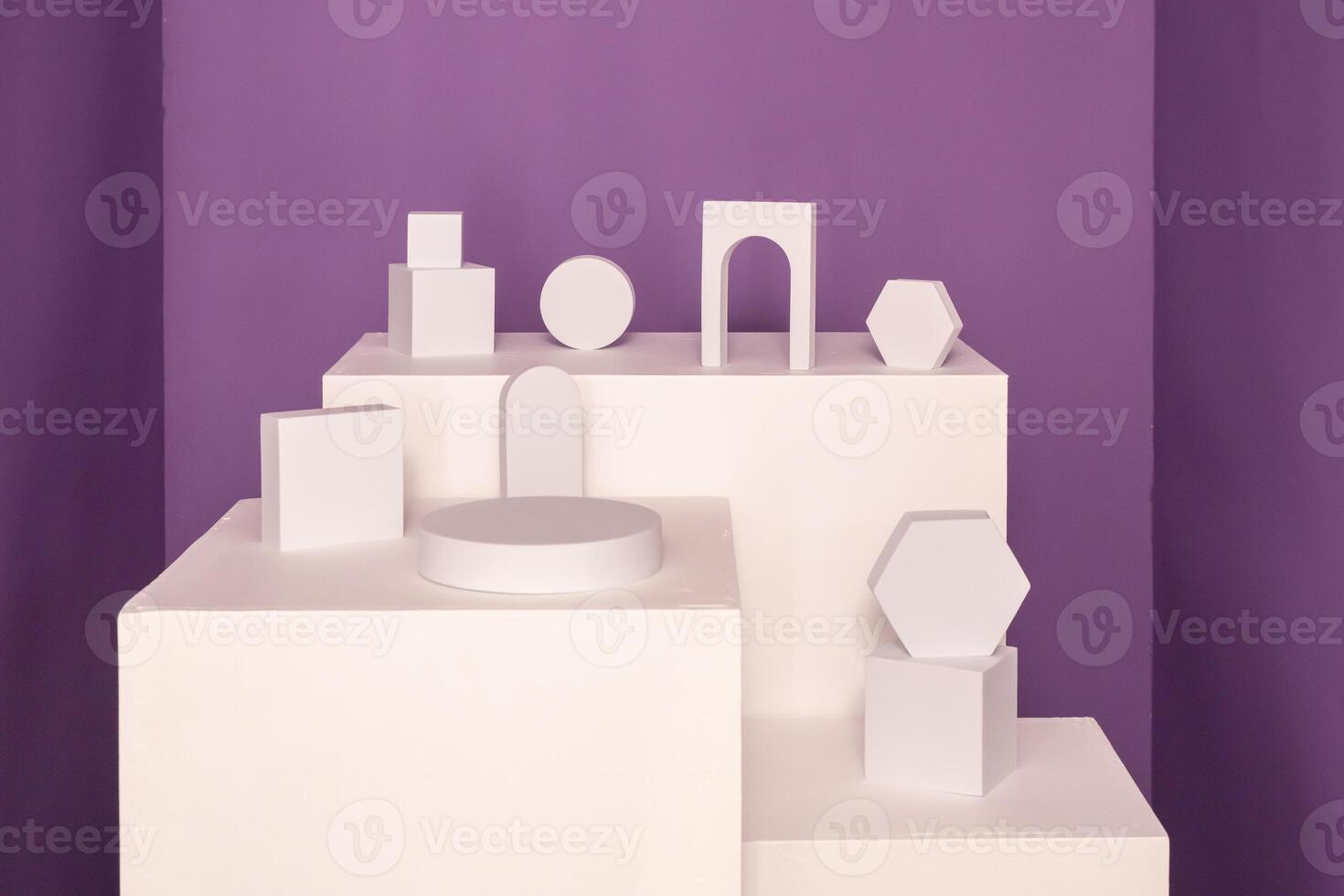 Pedestal for cosmetic product and packaging mockups with white shapes over violet background. photo