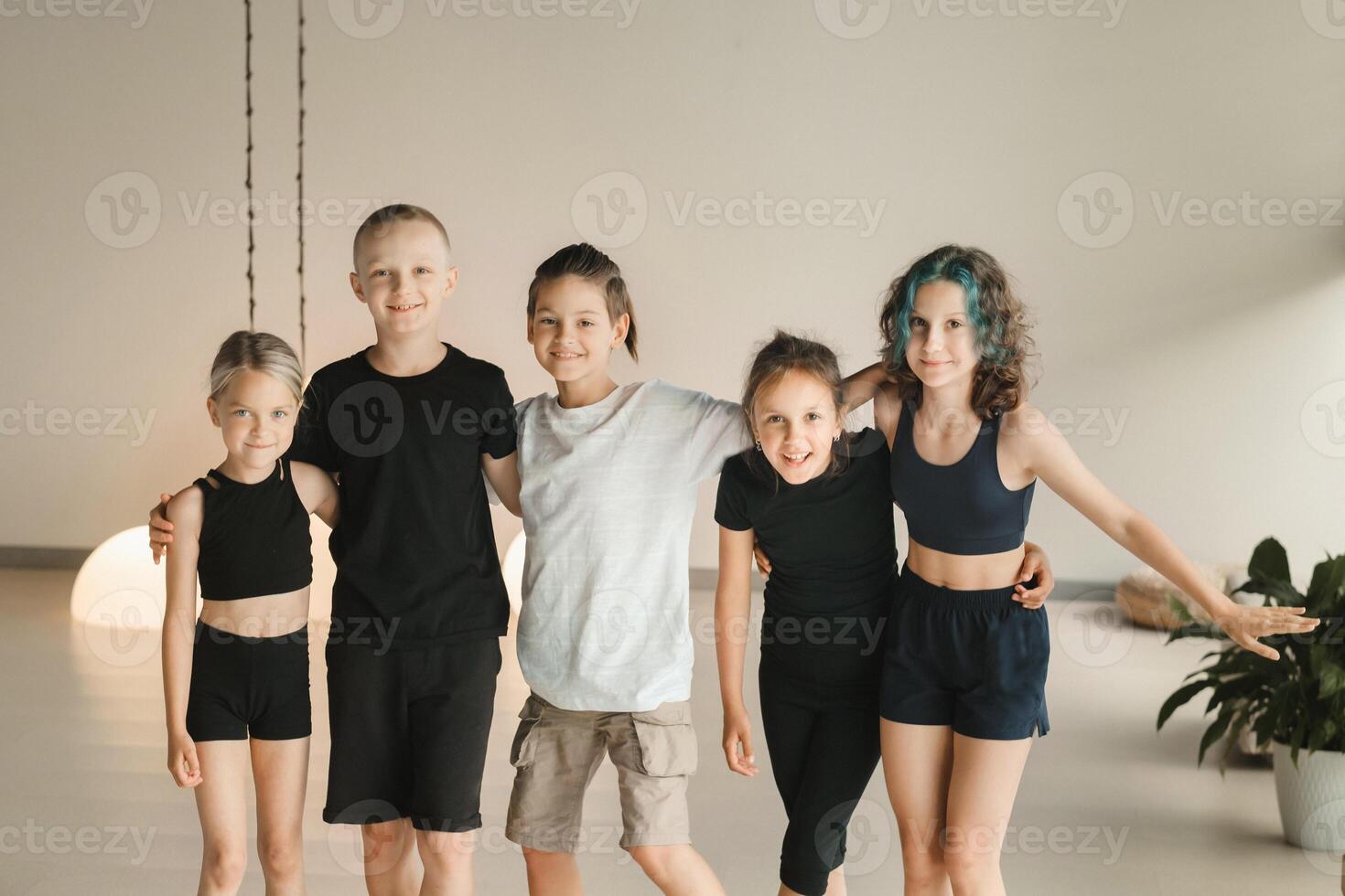 Portrait of a group of children in the fitness room. Children's yoga photo