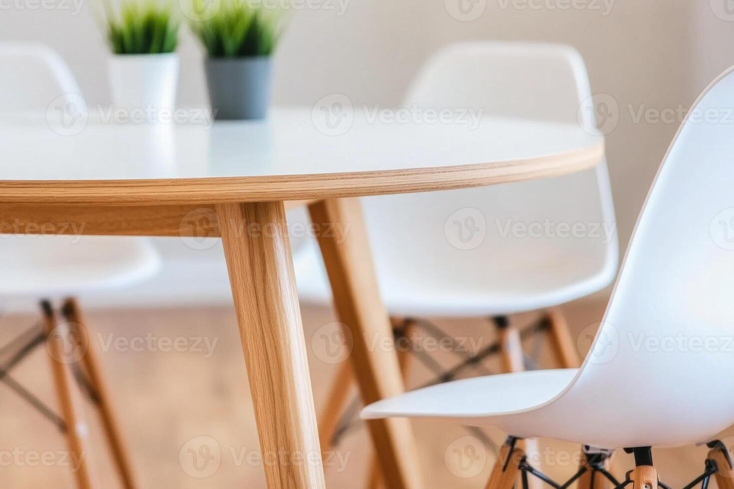 Diverse team engaged in conversation around a round table in a modern, minimalistic workspace photo