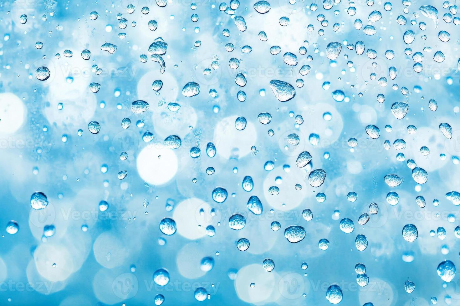 Elegant wall-mounted showerhead with rainwater effect in a bright polished bathroom showcasing cascading water droplets photo
