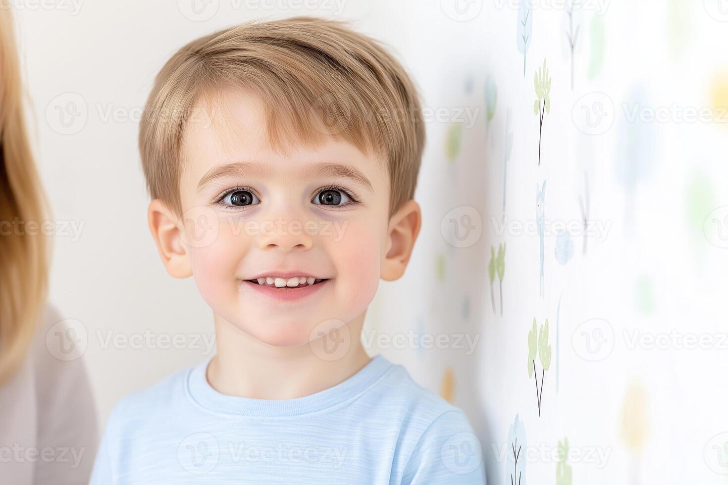 Young boy proudly standing against a height scale while mom takes note in a bright home environment photo