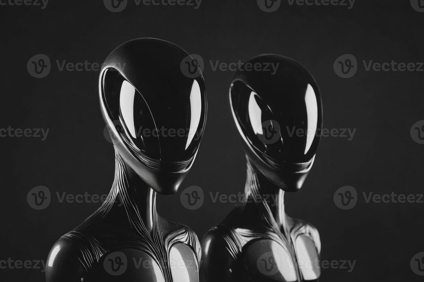 Eerie black and white depiction of two alien figures against a shadowy minimalist backdrop photo