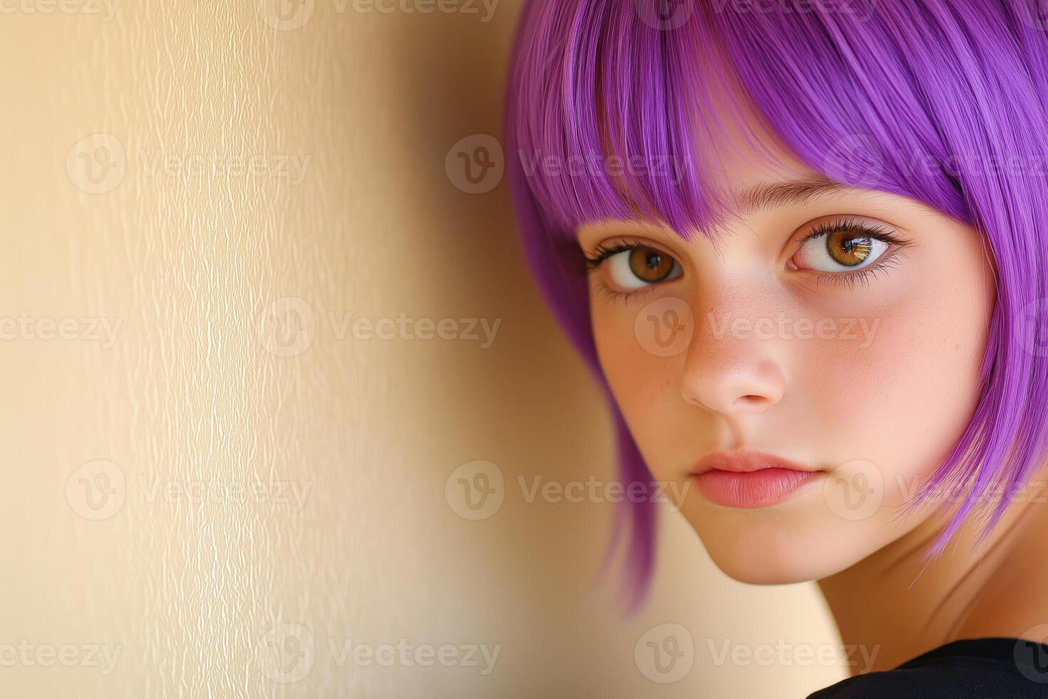 Thoughtful teenager with purple hair leaning against a wall in a softly lit room photo