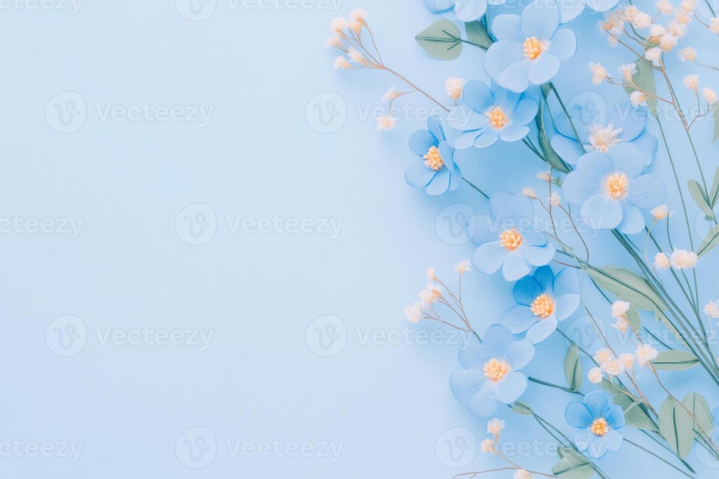 Delicate blue floral embroidery design featuring small flowers and leaves on a soft light background photo
