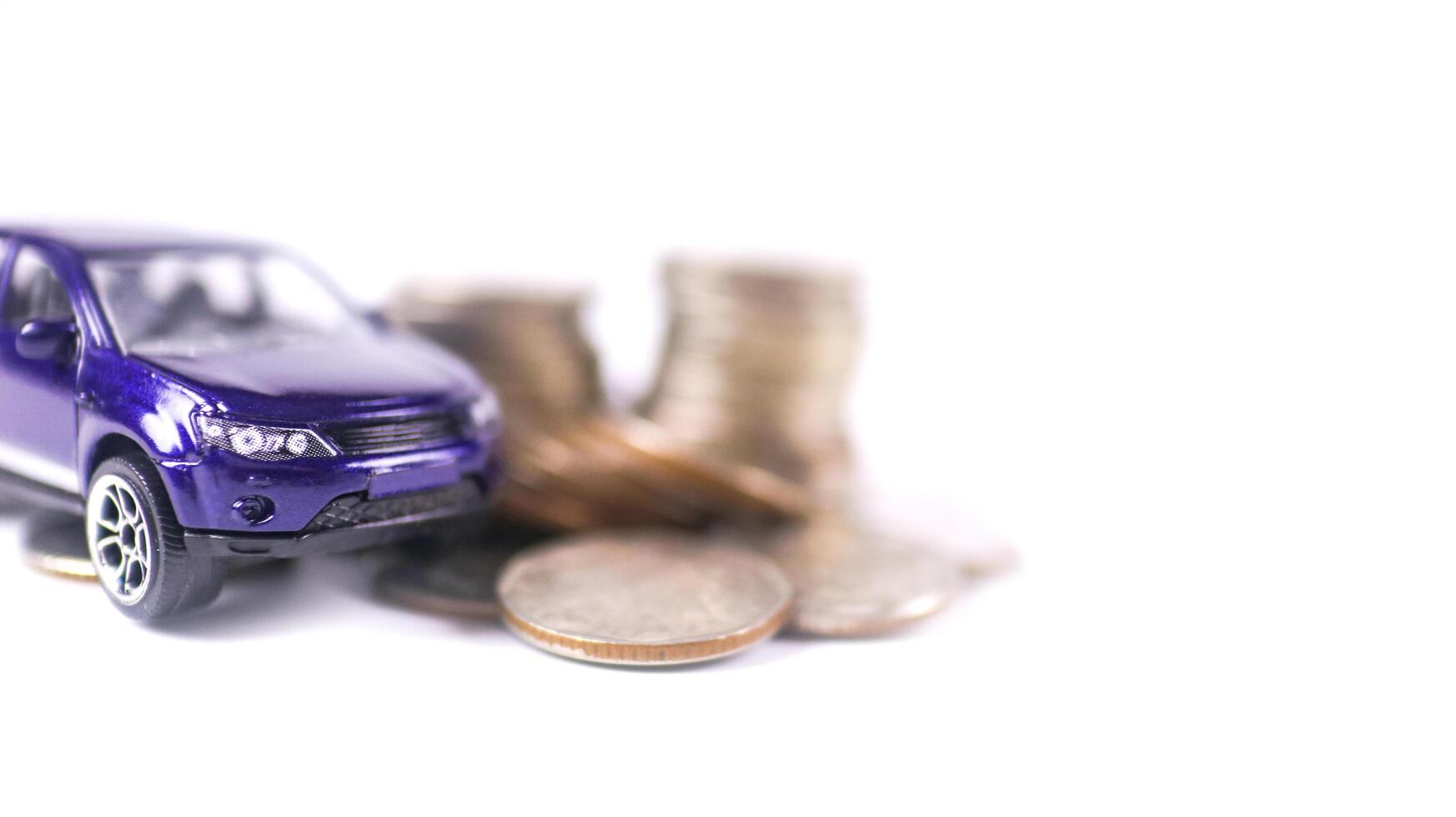 Model car with euro banknotes on white background concept of saving for buying car, car loan and car insurance. photo