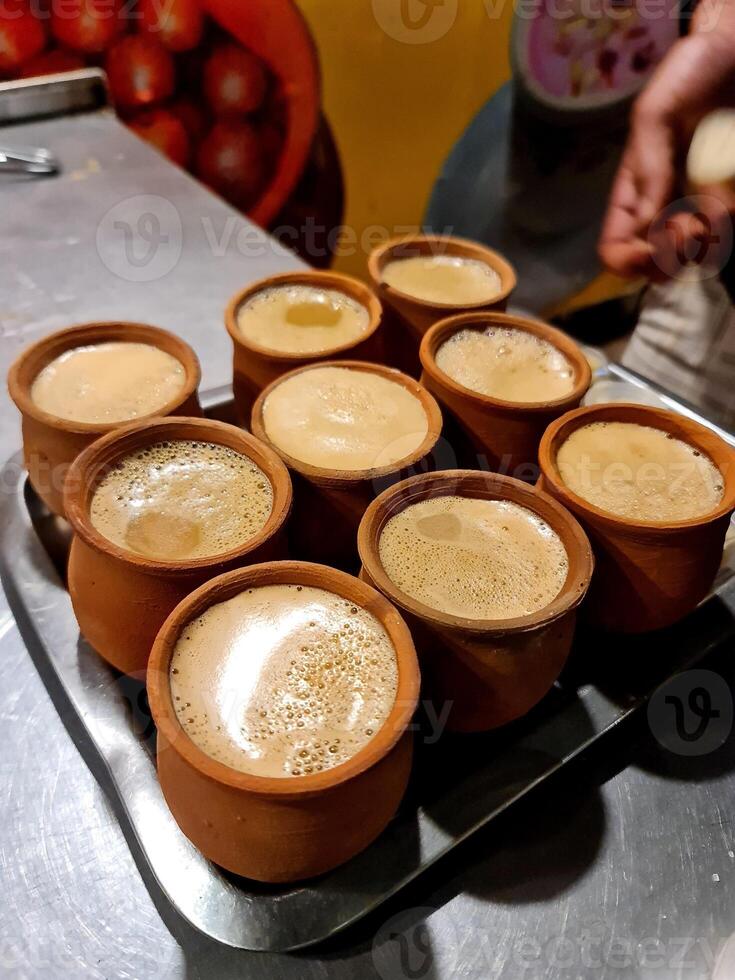 A tray of cups of coffee sitting on a table photo