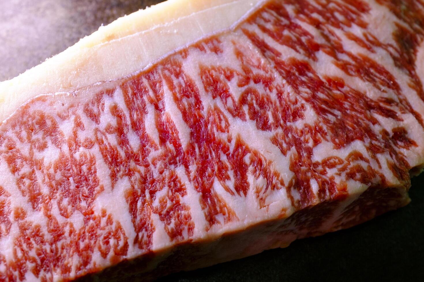 close up of a piece of raw beef.Fresh Wagyu steak with visible meat marbling photo