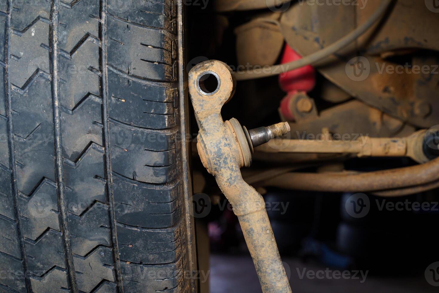 Old car ball joints, suspension background.The mechanic is repairing the truck suspension. photo