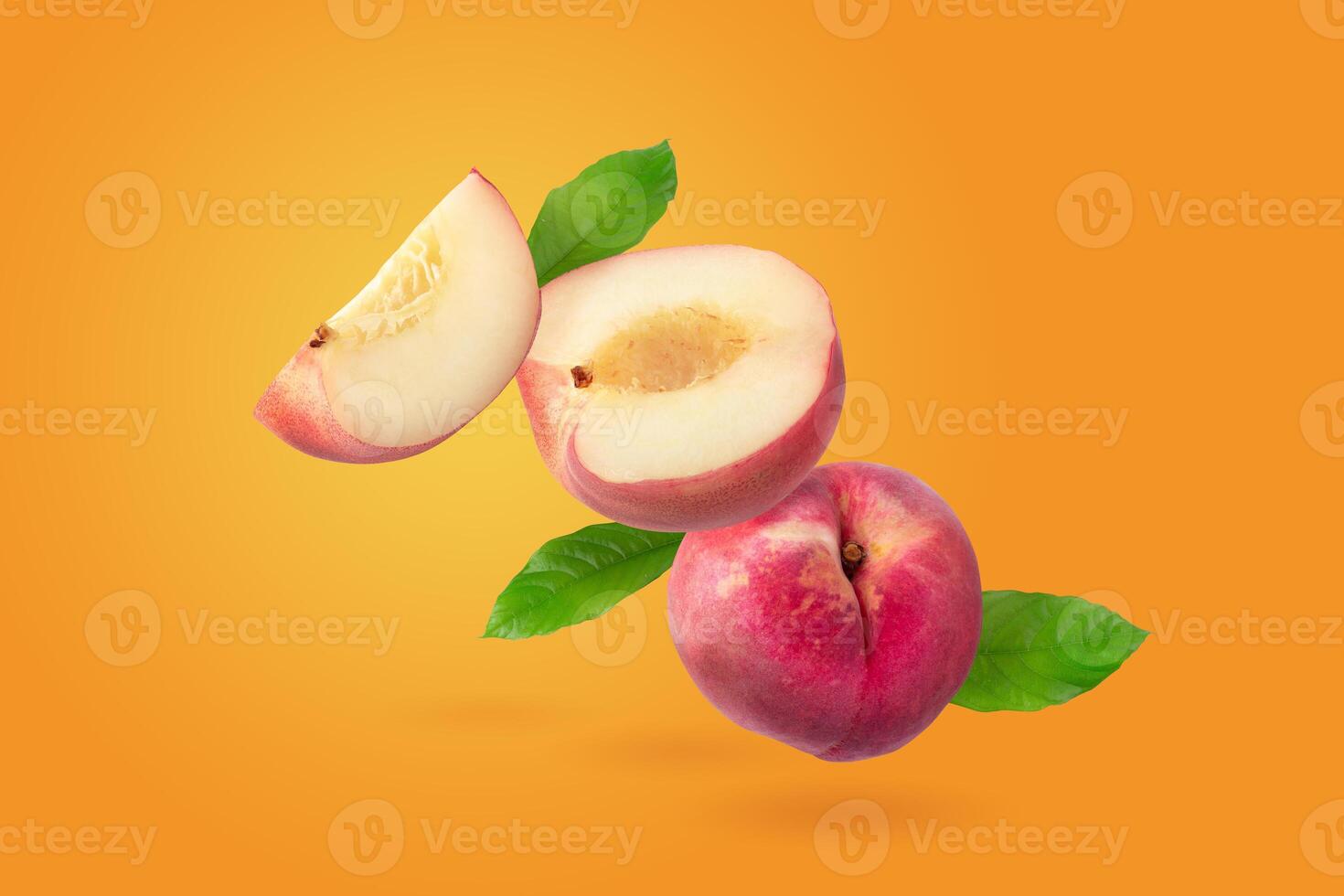 Peach and Peach slice isolater on a orange background photo