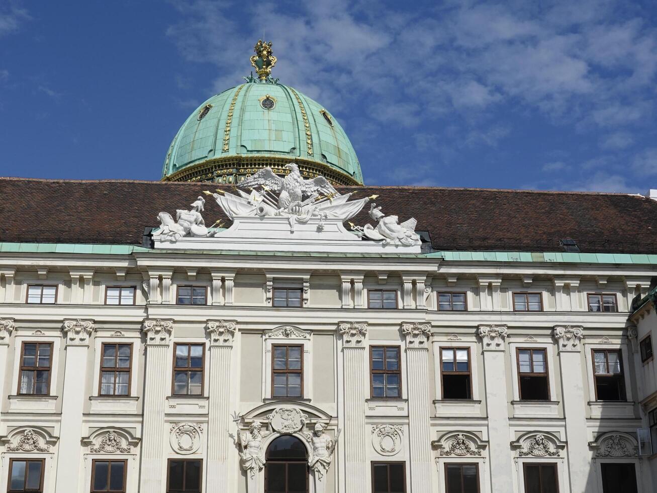Vienna, Austria - 11 September 2024 featuring a corner section with a domed roof covered in greenish patina copper, typical of historical architecture in Austria, Belvedere Palace in Vienna photo