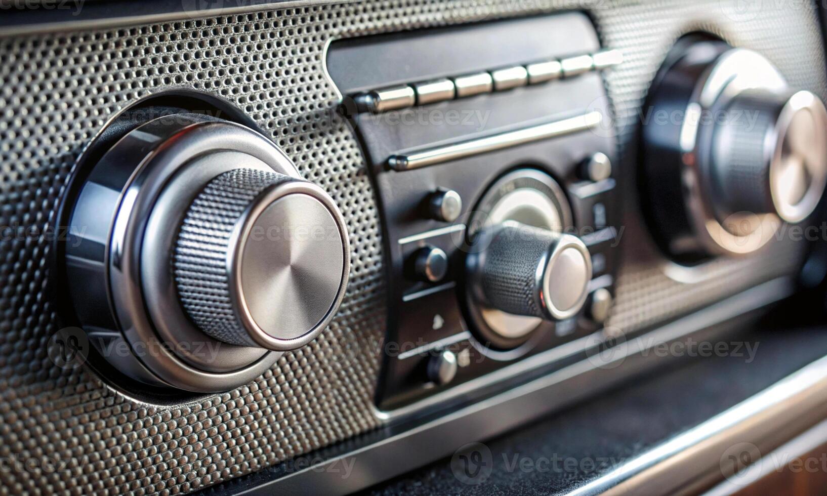 Silvery knobs for tuning the radio in the car interior photo