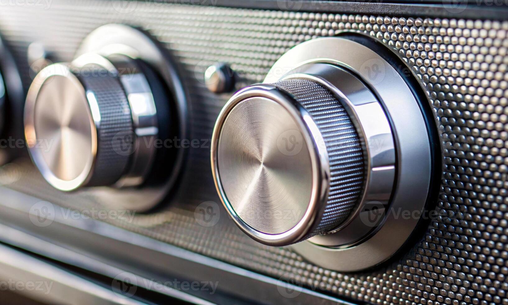Chrome radio tuning knobs in the car interior photo