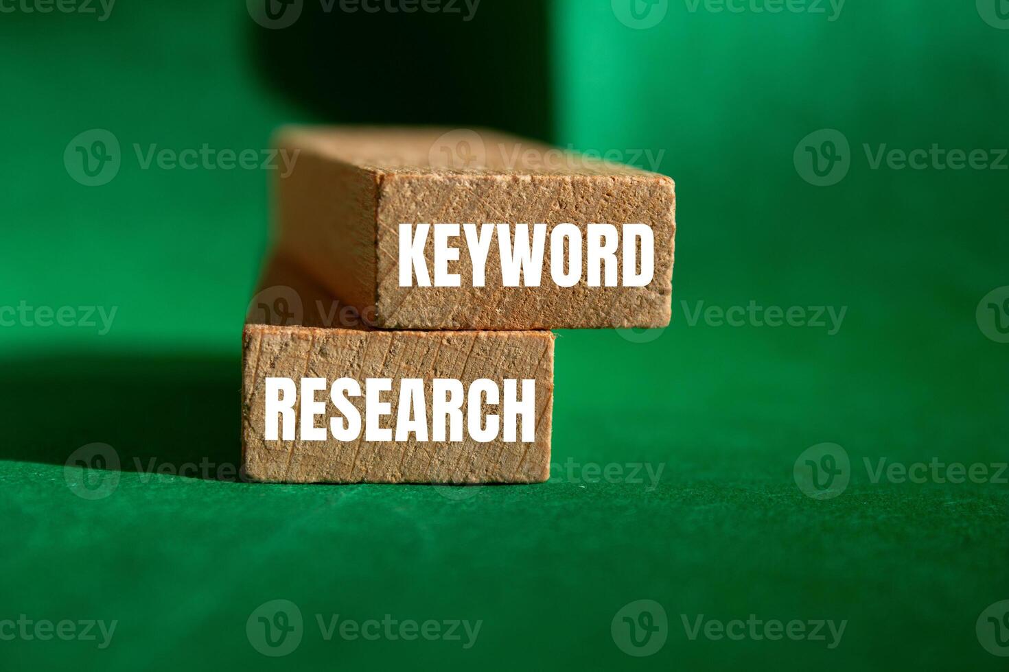 Keyword research message written on wooden blocks with green background. Conceptual keyword research symbol. Copy space. photo