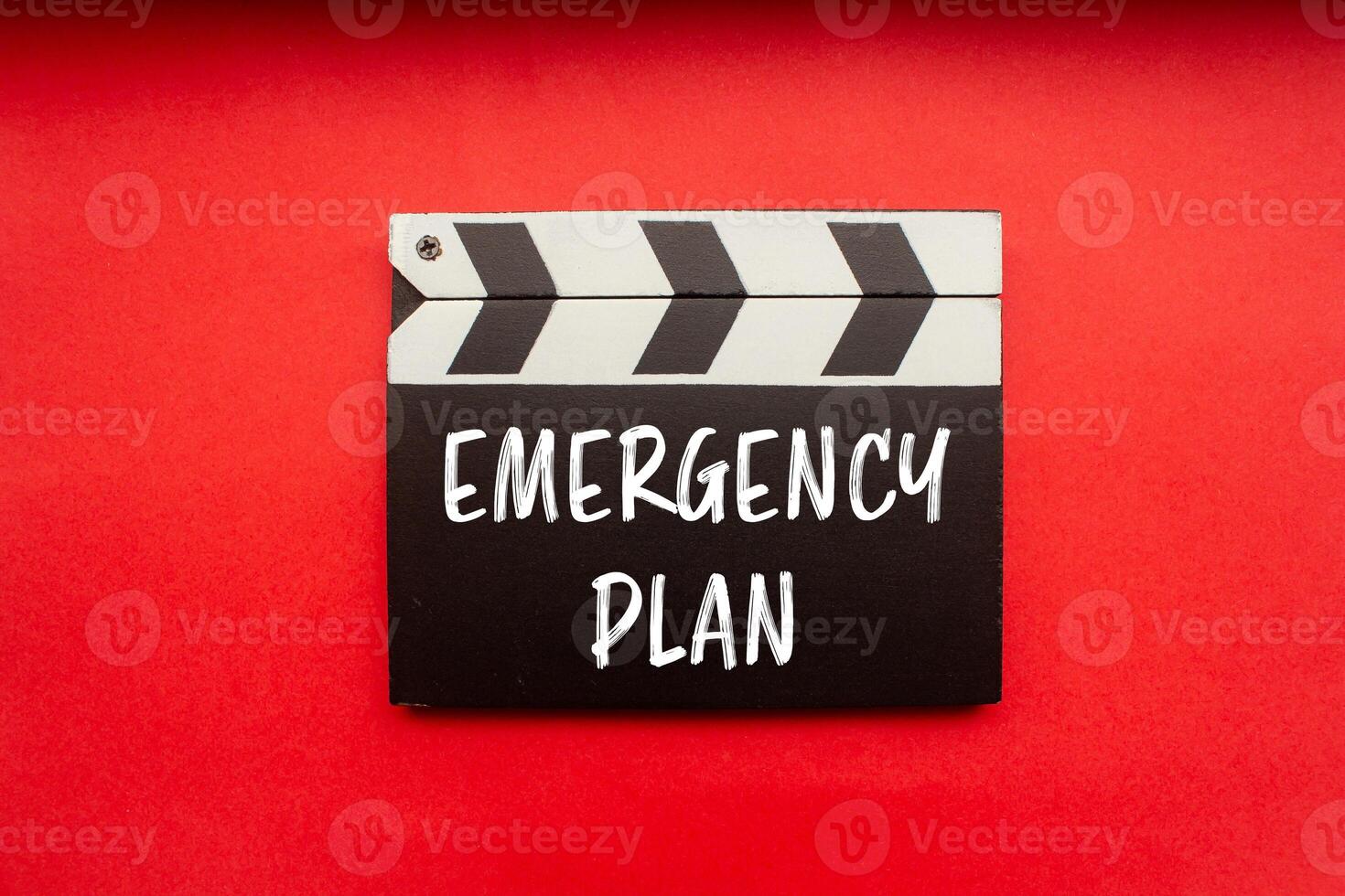 Emergency plan message written on clapperboard with red background. Conceptual emergency plan symbol. Copy space. photo
