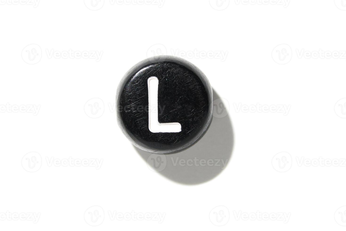 Black keyboard key with white letter l on white background. minimalist technology design photo