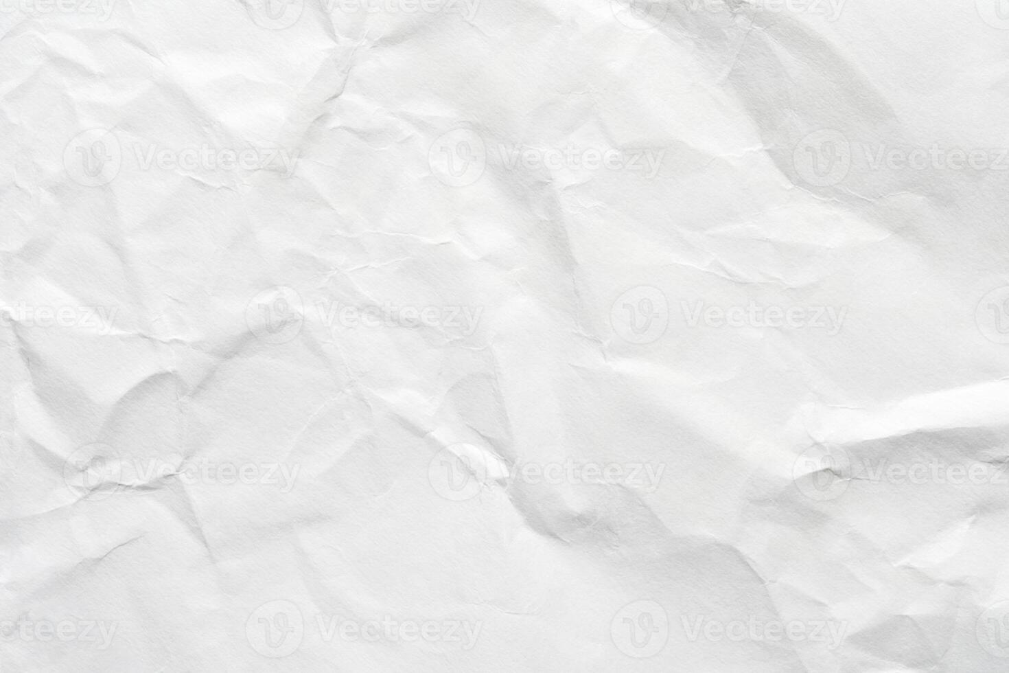 Crumpled white paper texture with natural creases and subtle shadows for backgrounds and design projects. photo