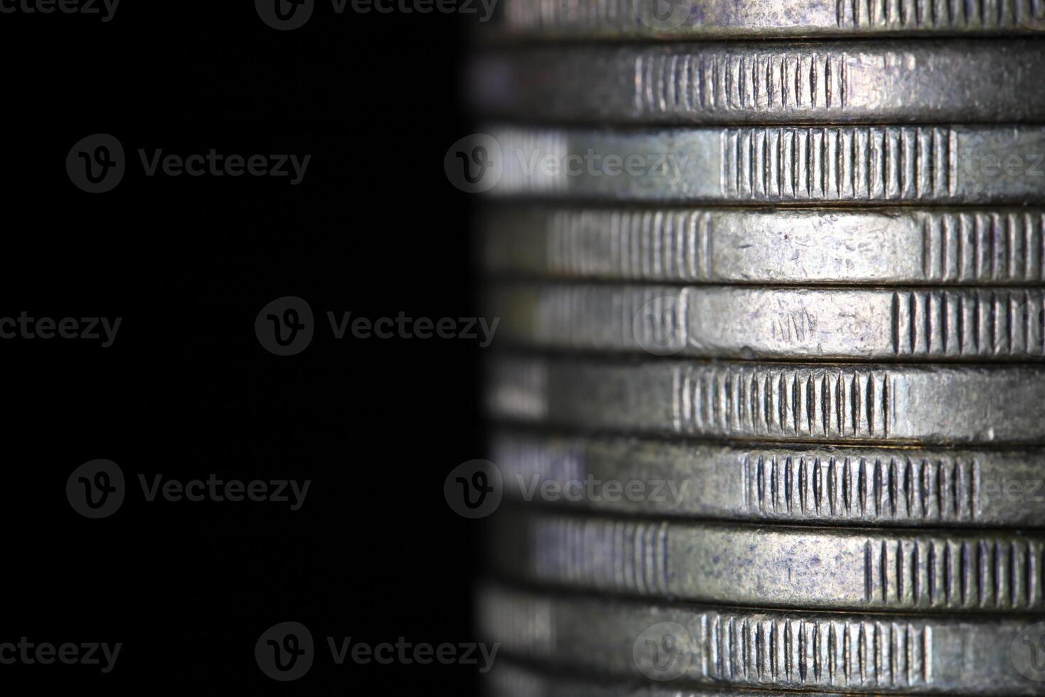Stack of coins in close-up, texture of old coins photo