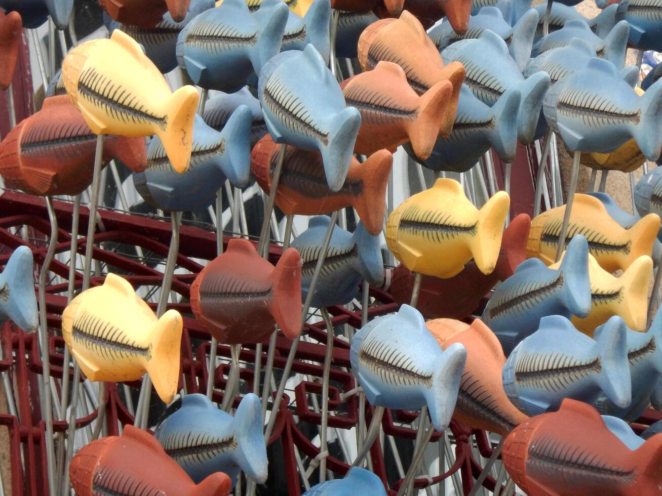 Hanging goldfish fleeing in the same direction photo
