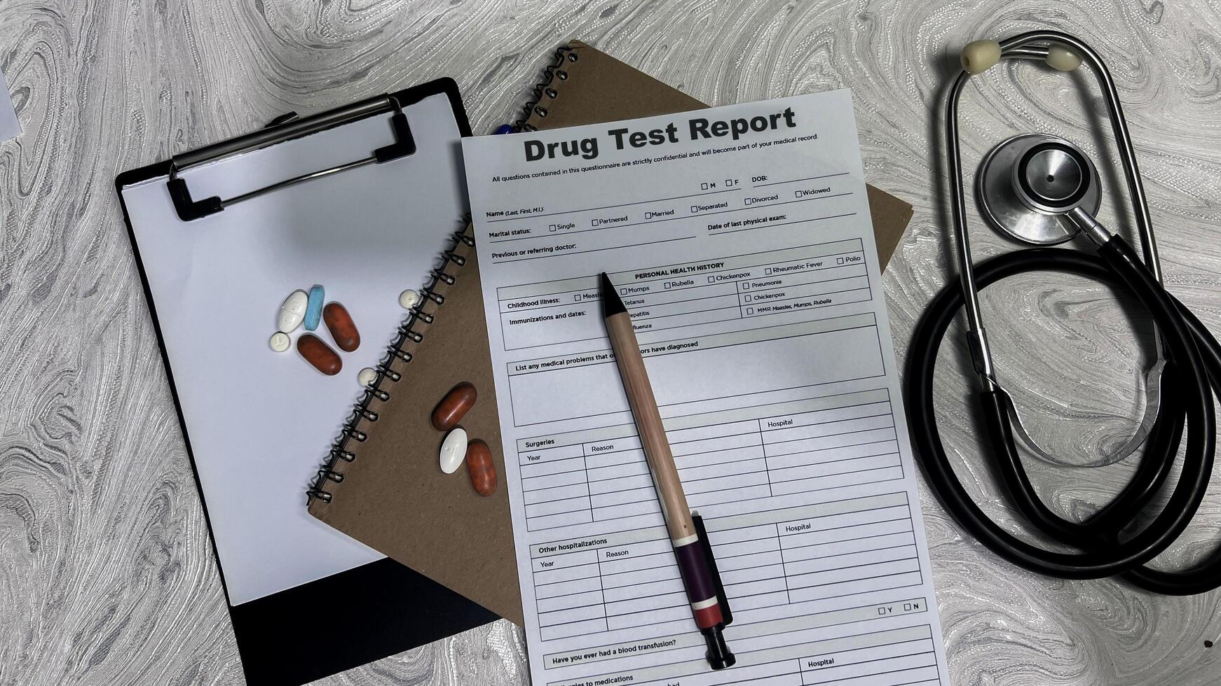 Concept of Drug Test Report write on document isolated on Wooden Table. photo