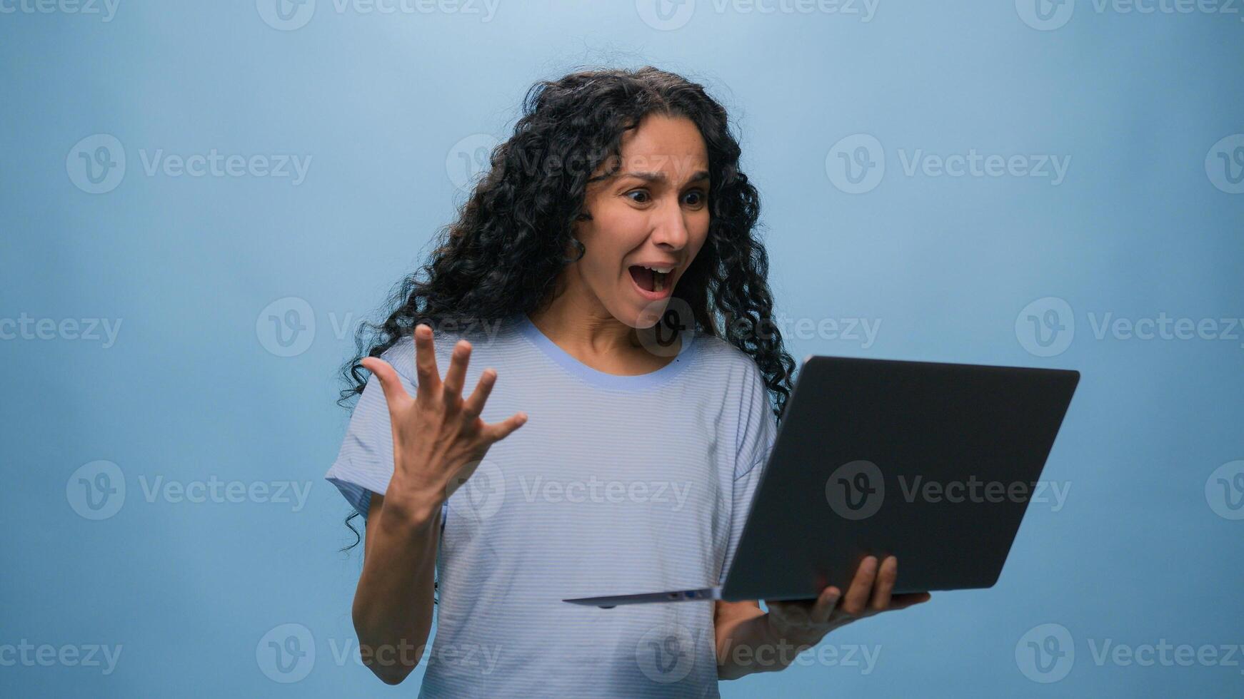 Excited woman female Latino student girl Hispanic user business win laptop online achieve victory computer bet good result champ efficient coding achievement level up bonus at blue studio background photo
