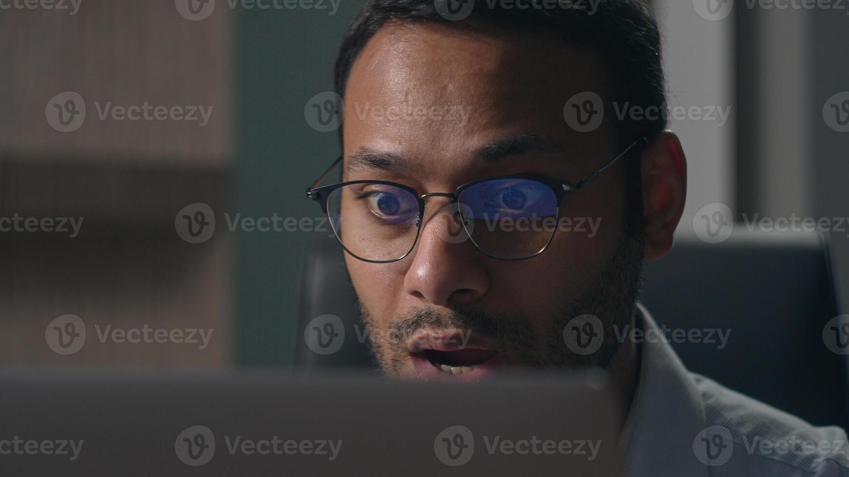 Indian shocked stressed amazed bad wonder businessman shock Arabian man American confused worker employer looking with big eyes in laptop computer screen afraid scare negative office business failure photo