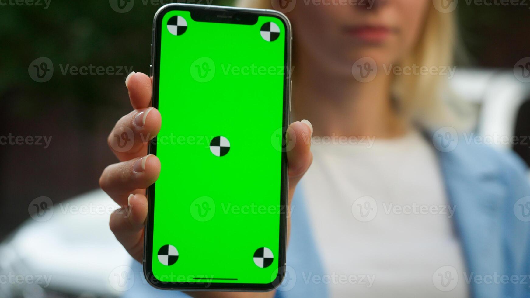 Smiling glad Caucasian woman girl lady car rent service client show mobile phone green screen auto driver thumb up sign recommend app approval gesture in city female businesswoman automobile transport photo