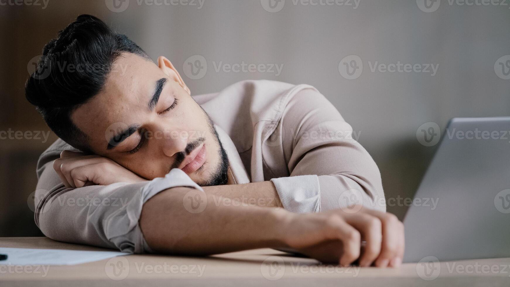 Sleepy unproductive man office male worker businessman falling asleep at office desk tired multiracial student closed eyes feeling exhausted after routine tasks hard computer work overworked concept photo