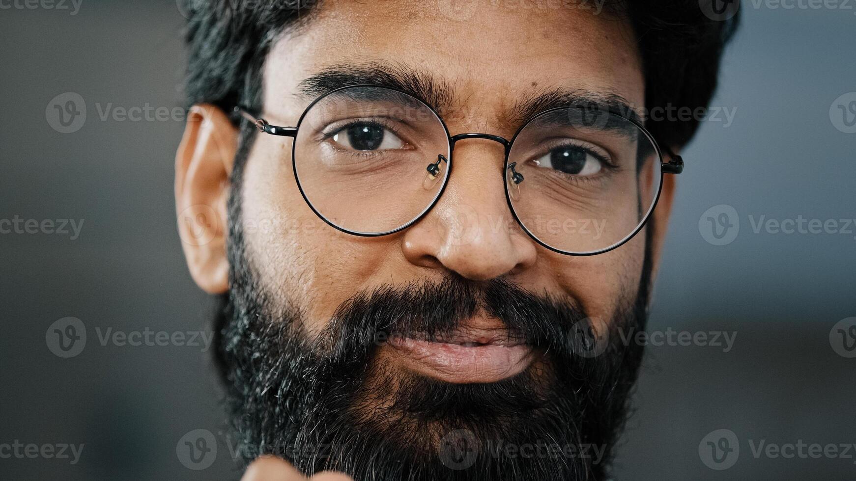 Portrait hispanic arab bearded brunet man thoughtful pensive businessman employee guy stand indoors concentrated think of solution hold hand on chin come up with idea talk at camera share information photo
