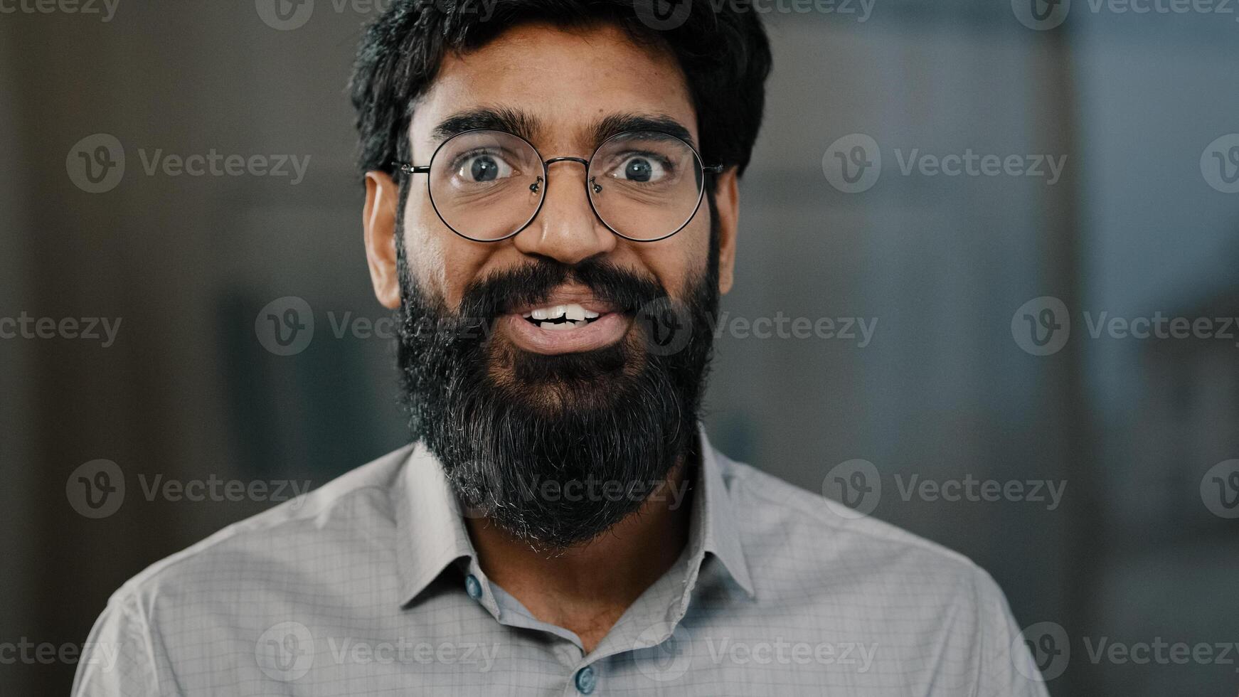 Male portrait surprise emotion enthusiastic surprised shocked arabian amazed man in eyeglasses make big eyes indian businessman winner demonstrate wow emotion face expression say wow happiness triumph photo