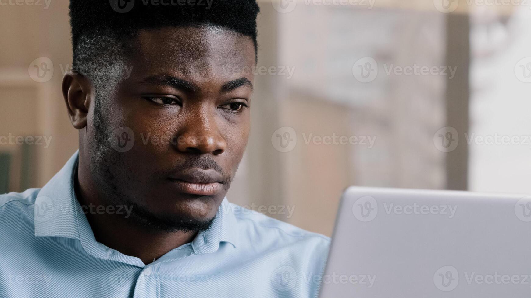 Close-up african american young male businessman freelancer web designer work online on personal computer use wi-fi adult boss millennial man search job vacancy in internet typing text email chatting photo