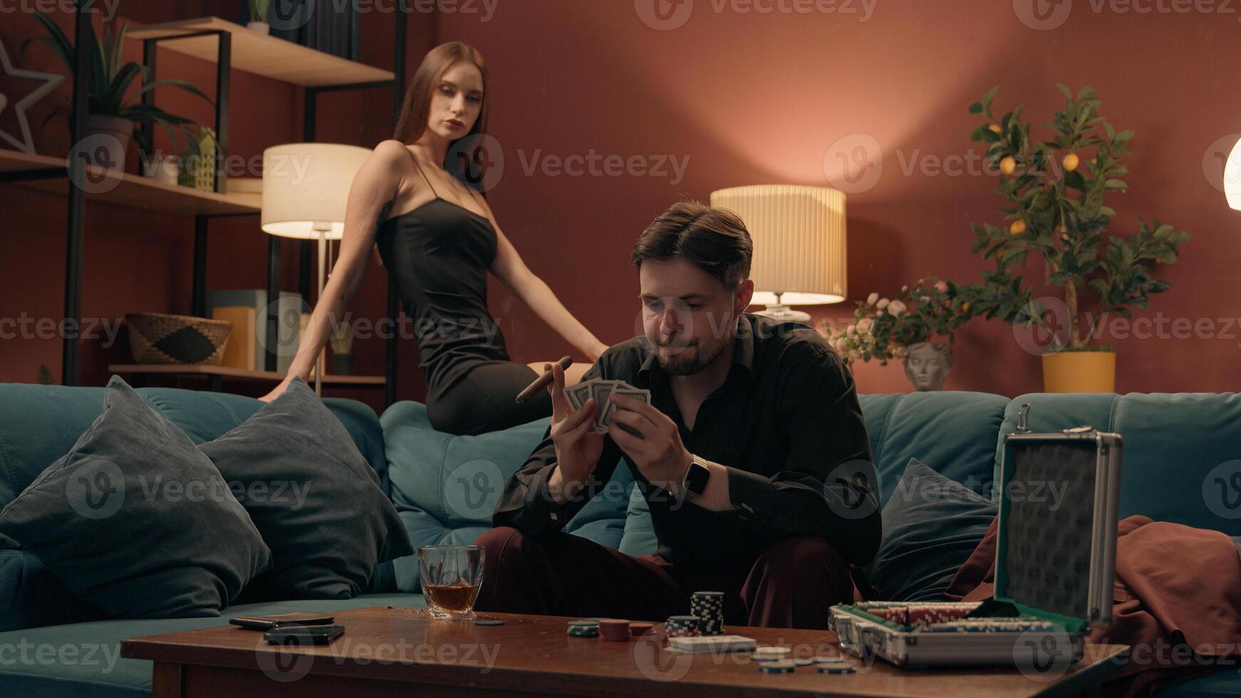 Caucasian couple upset woman female girlfriend in dress looking at angry mad stressed man male guy boyfriend player gambler throwing playing poker cards losing game betting lost gambling dating home photo