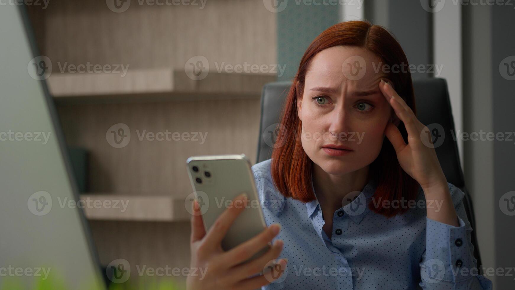 Caucasian shock stressed sad woman at desk in office with smartphone unhappy negative emotions upset business girl businesswoman take off glasses stress bad news terrible SMS mobile phone failure lost photo