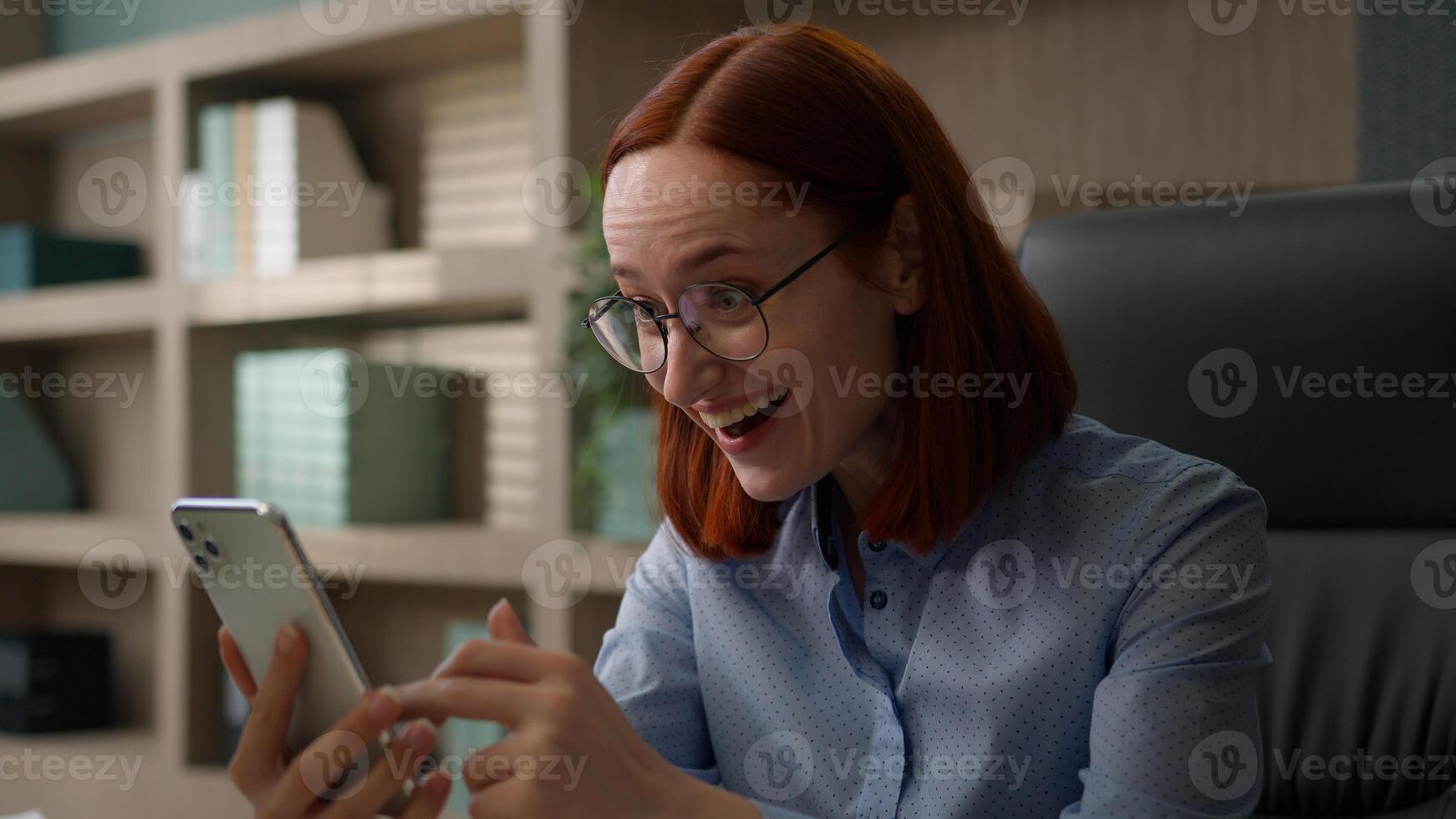 Happy excited female winner Caucasian woman business manager office worker girl businesswoman receive good news opportunity achievement prize notification win mobile phone winning smartphone victory photo
