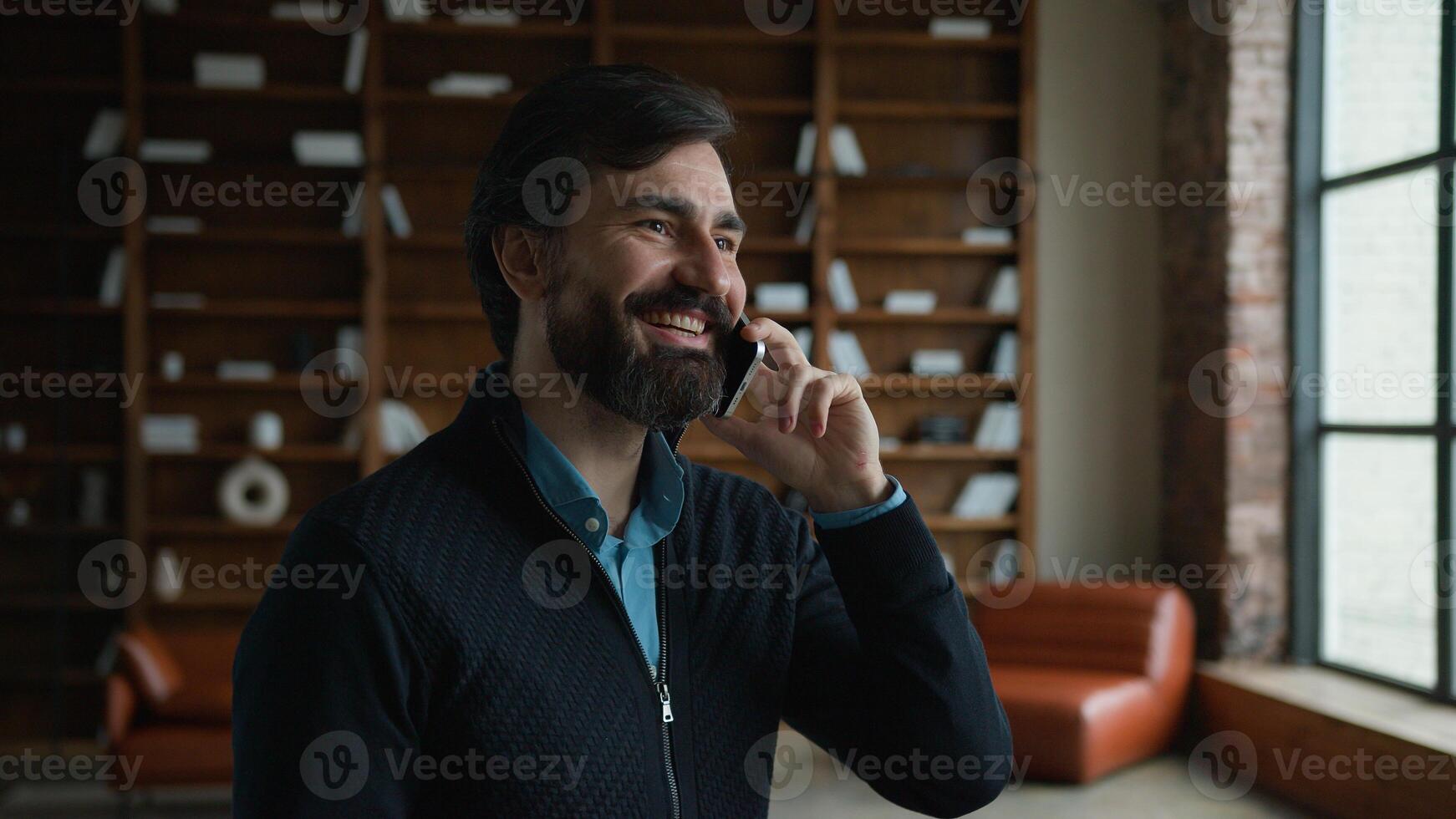 Happy smiling Caucasian senior bearded male man guy businessman psychotherapist talking mobile cellphone phone call device psychologist speaking remote consulting planning business appointment office photo