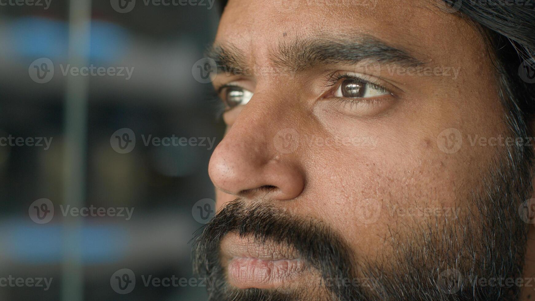Close-up pensive serious puzzled thoughtful bearded indian man face businessman ethnic arabian guy thinking idea think business problem ponder question dreaming search difficult solution male portrait photo