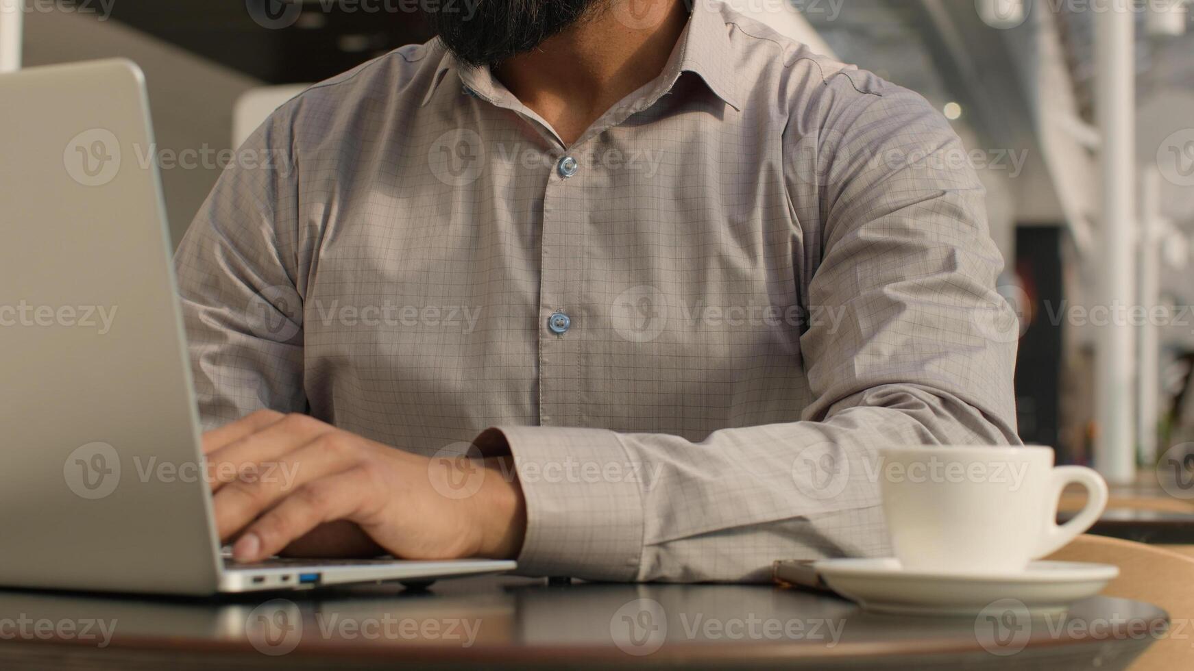 Close-up unrecognizable man guy typing on laptop businessman freelancer programmer working remote on internet using computer application in cafe make order in online store send email to social network photo