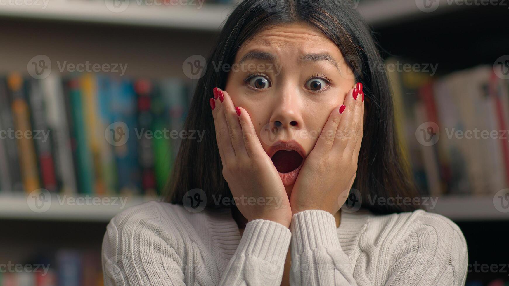 Amazed excited shocked stressed asian woman girl student teacher worried about bad news frightened expression open mouth feeling stress in library problem at university exam failure female portrait photo