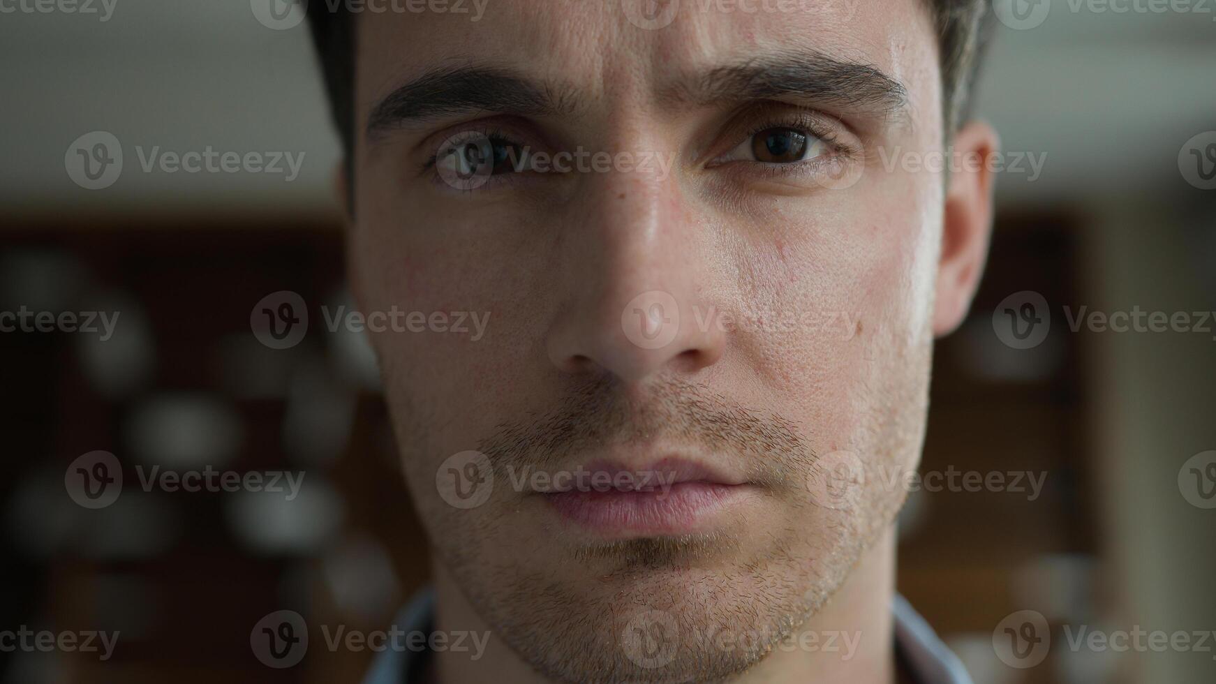 Serious sad pensive young adult Caucasian man guy businessman portrait male student freelancer business manager model looking camera indoor office room mental health problems anxiety depression crisis photo