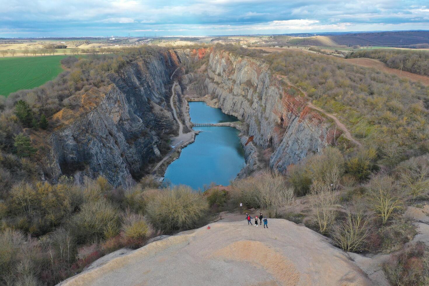 A view of a canyon with a lake in the middle photo