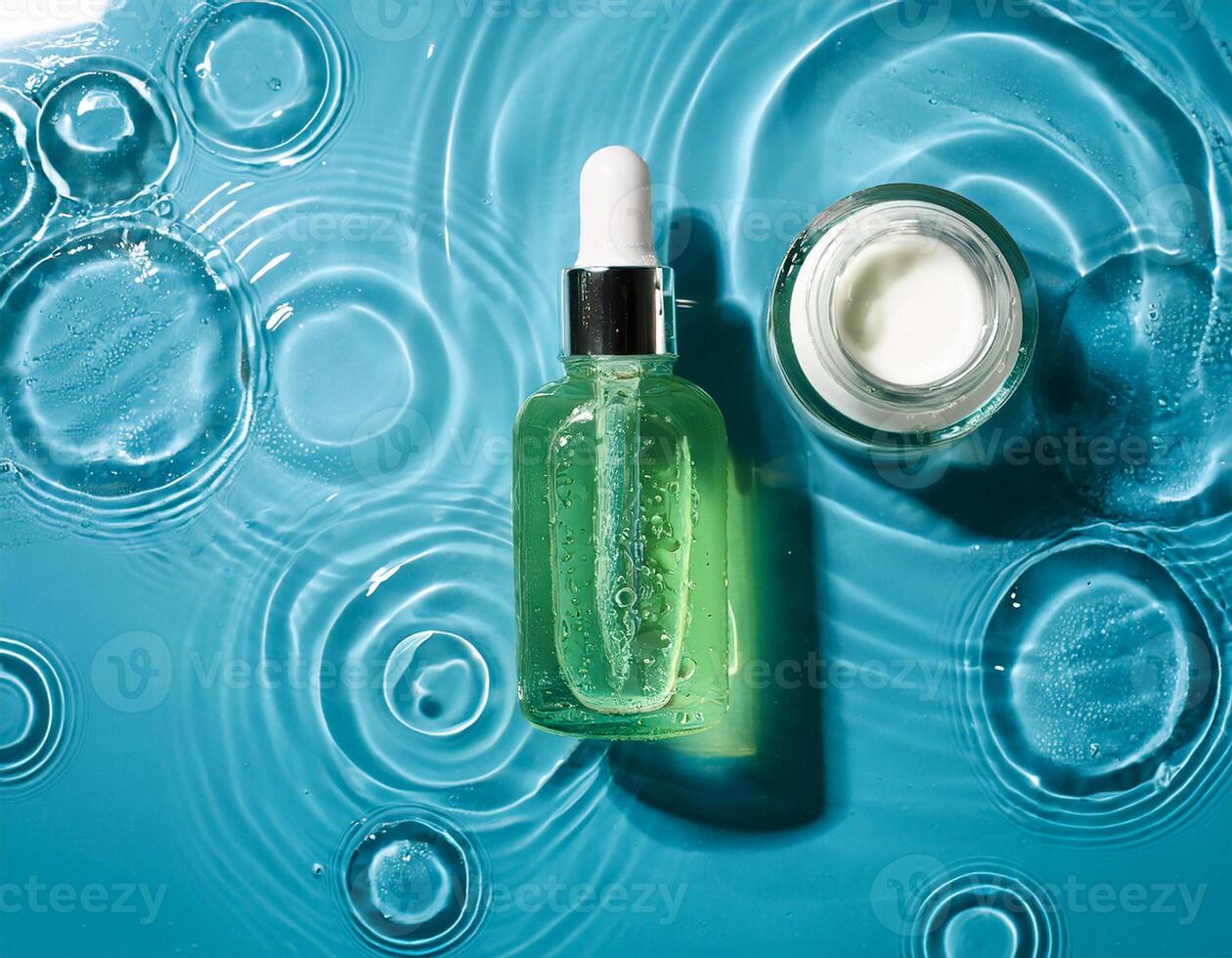 A bottle of green liquid and a jar of cream photo