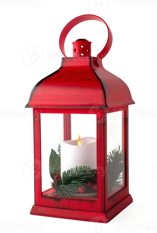 Red Christmas lantern with white candle with pine branches isolated on a white background photo