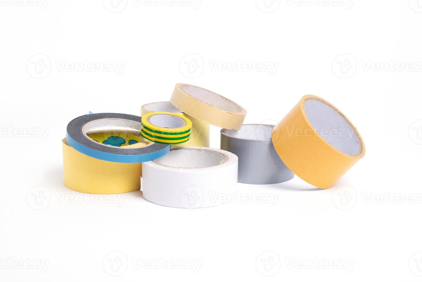 A heap of packing tape and a masking tape isolated on white background, with clipping path. adhesive tape. Scotch tape. photo