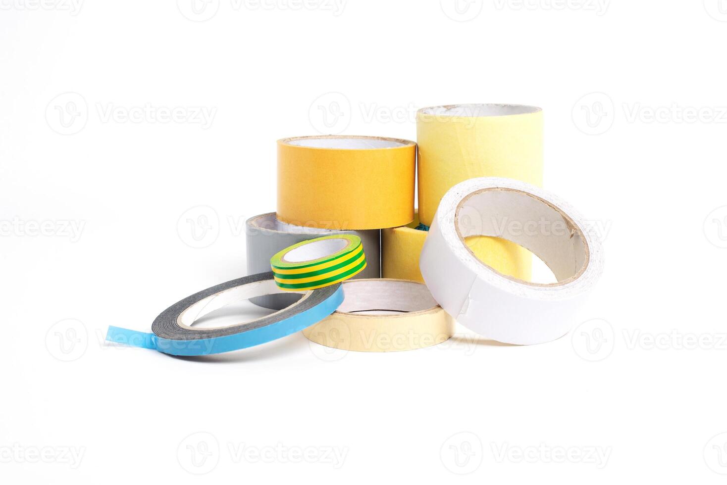 A heap of packing tape and a masking tape isolated on white background, with clipping path. adhesive tape. Scotch tape. photo