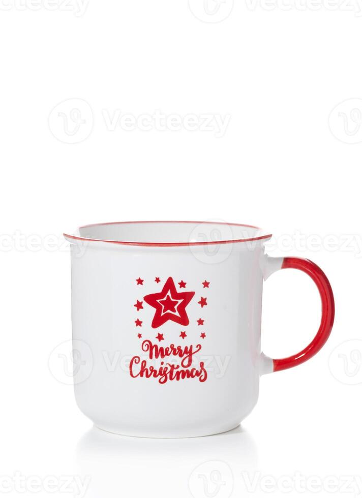 A white cup with a red handle and New Year inscriptions and patterns isolated on a white background photo