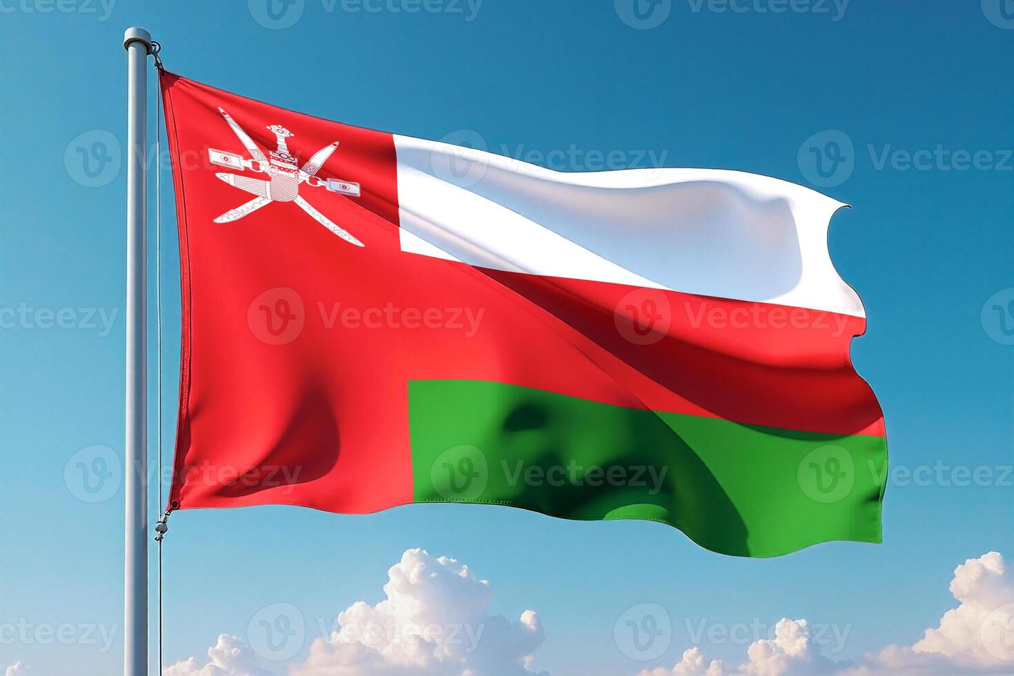 Oman Flag Waving Against Clear Blue Sky photo