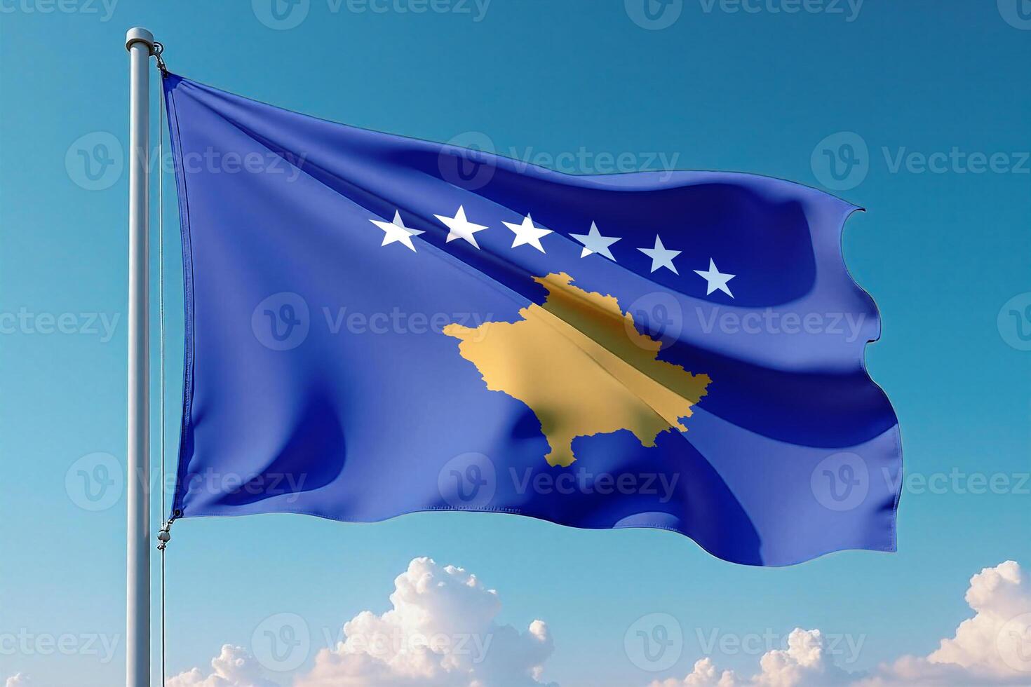 Kosovo Flag Waving Against Clear Blue Sky photo